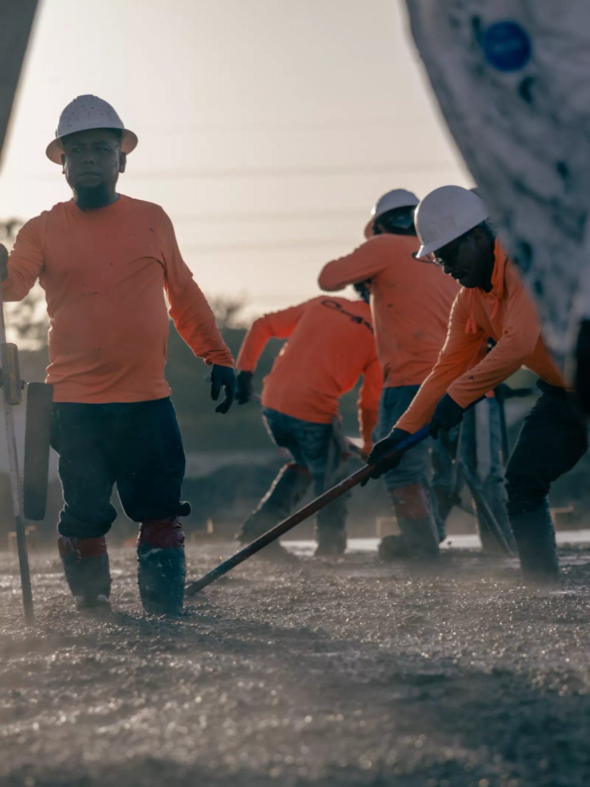 Cougar Companies crew screeding fresh concrete on a jobsite